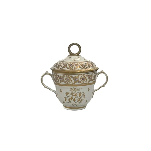 191 - An English porcelain twin handled chocolate cup and cover, dated 3rd Sept 1797, with monogram, proba... 