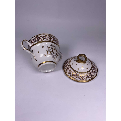 191 - An English porcelain twin handled chocolate cup and cover, dated 3rd Sept 1797, with monogram, proba... 