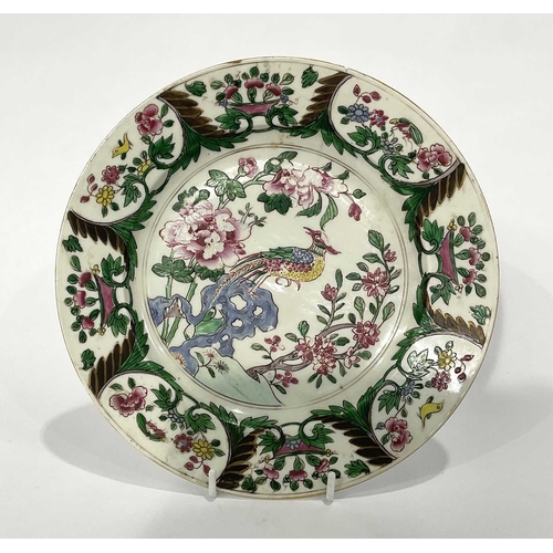 217 - A tea bowl and saucer, with hand-painted floral decoration, possibly 18th century, with a Guangxu st... 