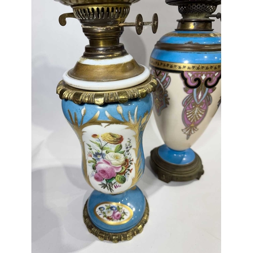 227 - Two oil lamps: Henry Greene & Son of London, ceramic body decorated in the manner of Zsolnay Pec... 