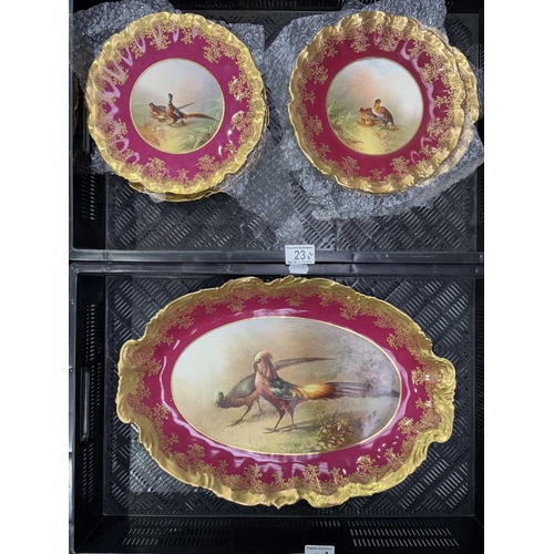 23 - A 'Game Bird' series Limoges dinner service, 10 plates together with a large oval platter, each uniq... 