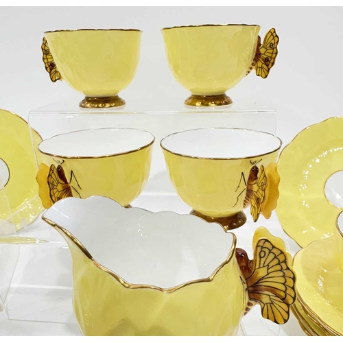 25 - An Aynsley 'Butterfly' tea service, c.1930, naturalistically moulded to resemble open flowers with r... 