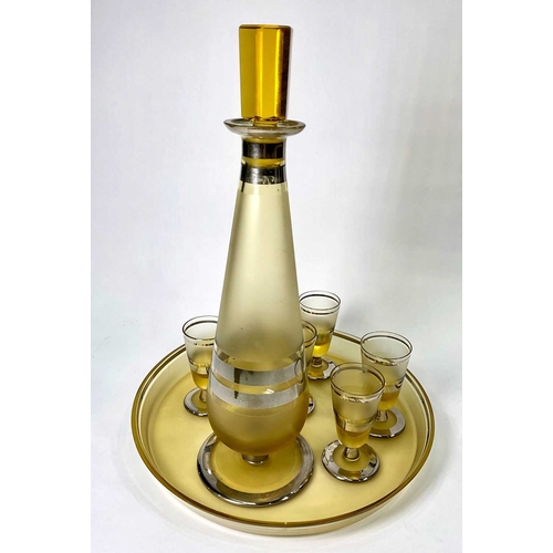 256 - A Continental frosted amber glass and silver lustre liqueur set including a decanter, tray and glass... 