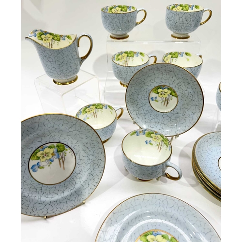 26 - A Paragon China part tea service, crackle glaze-effect blue ground with hand painted and transfer de... 