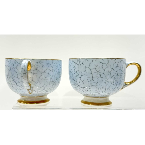 26 - A Paragon China part tea service, crackle glaze-effect blue ground with hand painted and transfer de... 