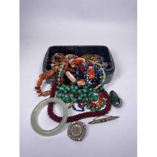 277 - An Indian hand painted papier mâché box containing a jade-coloured bangle and costume jewellery to i... 