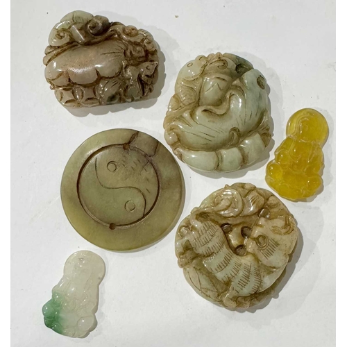 291 - A collection of Chinese jade-type and Nephrite pendants carved with tiger, fish, floral and yin-yang... 