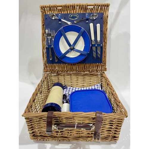 30 - A vintage 'Optima' wicker picnic basket with contents, place settings for two, together with a colle... 