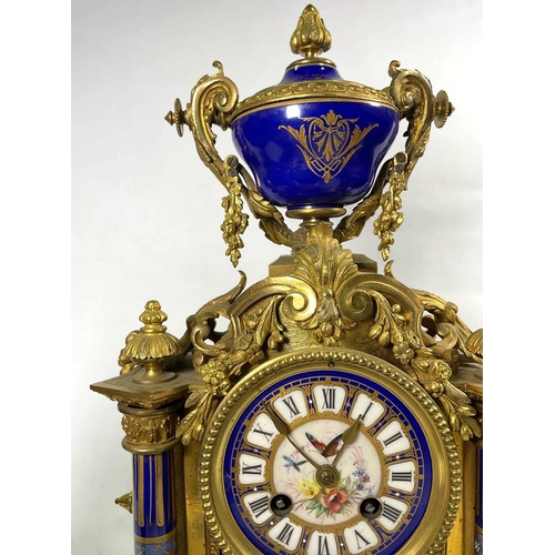 304 - A French gilt ormolu clock garniture, late 19th Century, of Baroque design with Sevres type porcelai... 