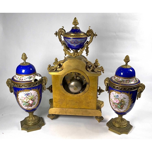 304 - A French gilt ormolu clock garniture, late 19th Century, of Baroque design with Sevres type porcelai... 