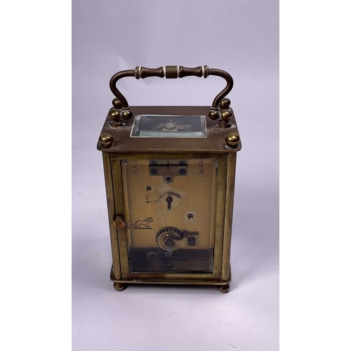 307 - A travel/carriage clock, Roman numeral dial, 10cm high, with original leather and velvet covered cas... 