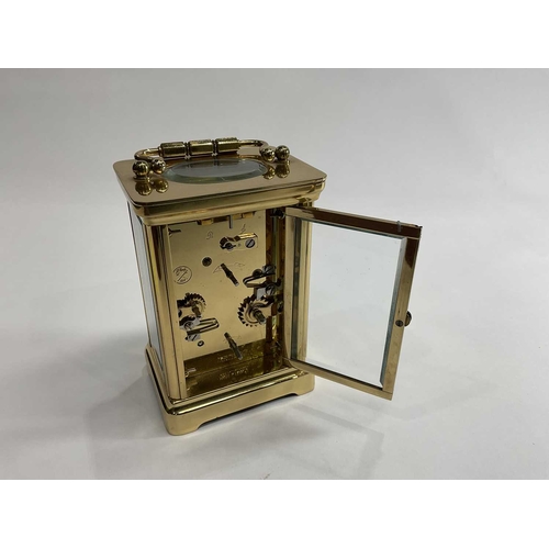 308 - Matthew Norman of London, 'Miniature 30-day carriage clock timepiece' brass carriage case with bevel... 