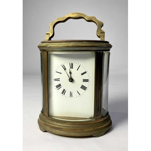 309 - A French carriage clock, early 20th Century, oval brass corniche case with visible escapement, white... 