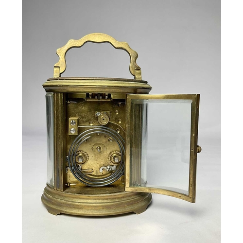 309 - A French carriage clock, early 20th Century, oval brass corniche case with visible escapement, white... 