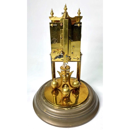 311 - A German brass weight-driven timepiece, 20th Century, silvered dial, under a glass dome, 27cm high... 