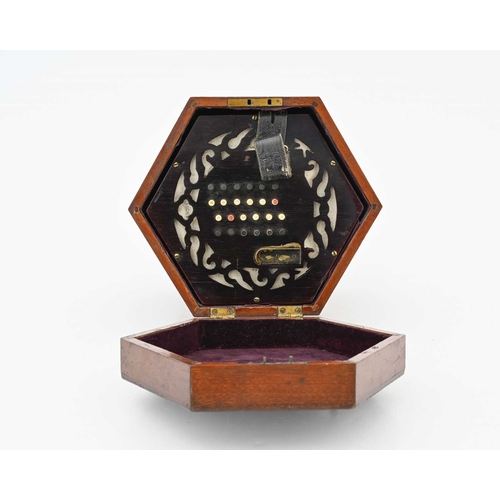 318 - Lachenal & Co, London, a concertina squeeze box, Serial No.43094, fretwork rosewood ends, forty-... 