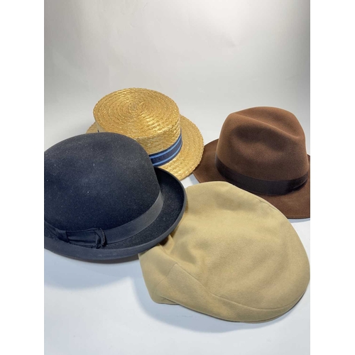 383 - Four gentleman's vintage hats, to include, a Dunn & Co. starw boater hat, size 7, a Dunn & C... 