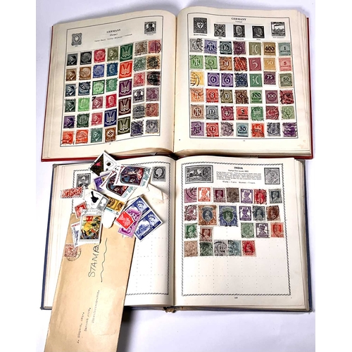 404 - Two Stamp Albums together with an envelope of loose stamps (2)