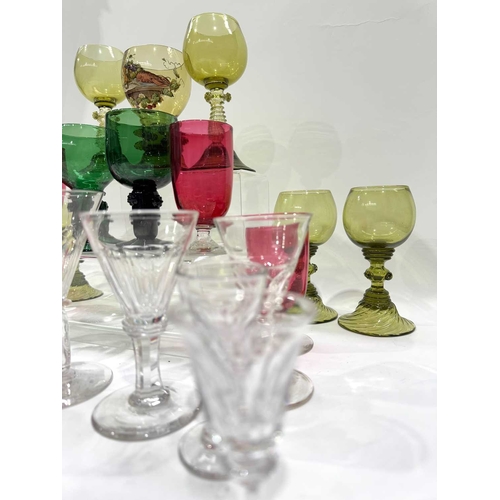 52 - A collection of green glass Germanic rummers with printed and trailed baluster stems and feet, ename... 