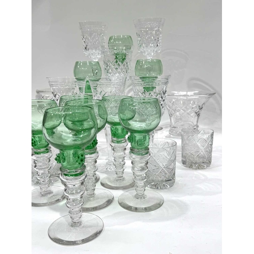 54 - A set of nine Bohemian uranium green and colourless glass Roemer type hock glasses, with raspberry p... 