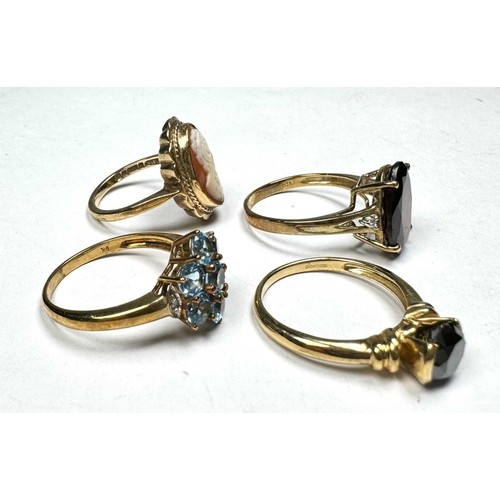 595 - Four gold coloured metal gem-set dress rings, marks to indicate 9ct gold, total weight 11.9g