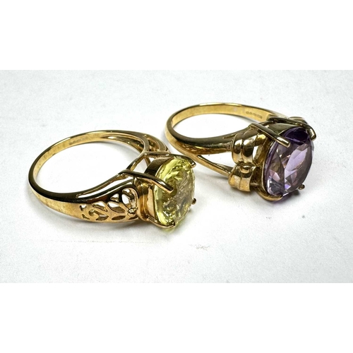 597 - A 9ct gold citrine single-stone ring, together with a 9ct gold amethyst single-stone ring, hallmarks... 