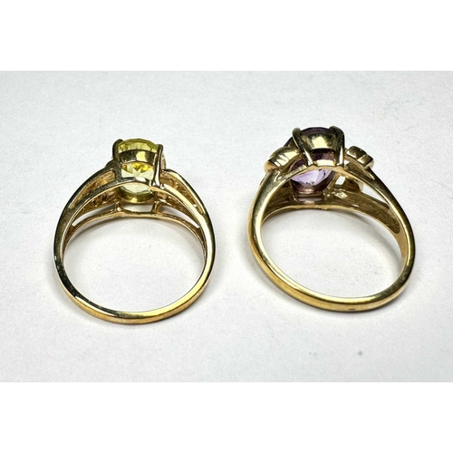 597 - A 9ct gold citrine single-stone ring, together with a 9ct gold amethyst single-stone ring, hallmarks... 