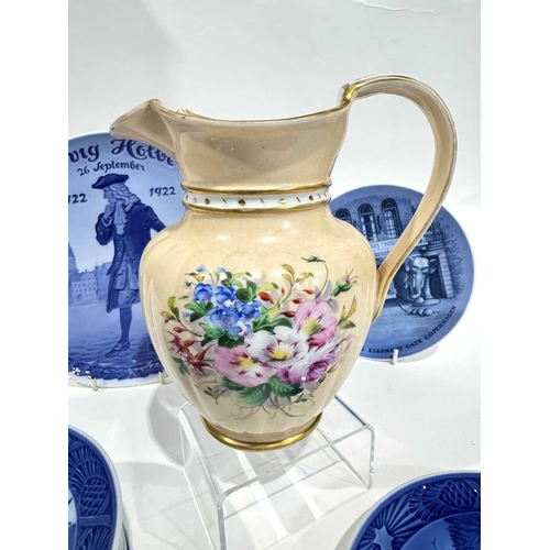 6 - Royal Copenhagen: a blush ground gilded jug and lid, factory mark to base, 19.5cm high, blue and whi... 