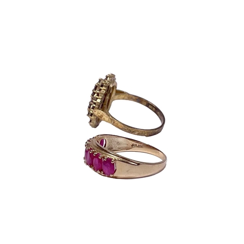 607 - A gold coloured metal oval-shape ruby half eternity ring, together with a silver gilt garnet cluster... 