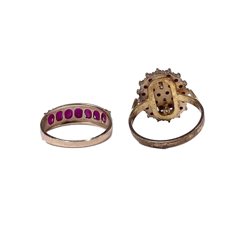 607 - A gold coloured metal oval-shape ruby half eternity ring, together with a silver gilt garnet cluster... 