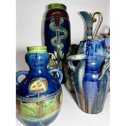 63 - A collection of Belgian art pottery, including various vases, incised Art Nouveau designs with marbl... 