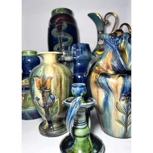 63 - A collection of Belgian art pottery, including various vases, incised Art Nouveau designs with marbl... 