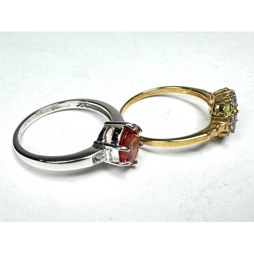 633 - Two 9ct gold gem-set rings, to include an orange sapphire single-stone ring, together with a green g... 