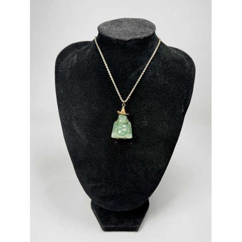 636 - A carved aventurine quartz Buddha pendant, with trace-link chain, pendant stamped 14k, length of pen... 