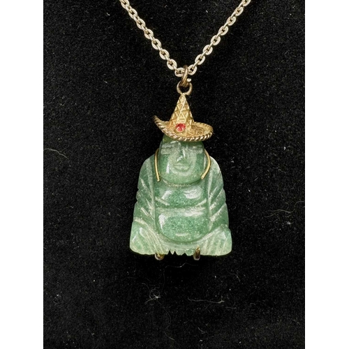 636 - A carved aventurine quartz Buddha pendant, with trace-link chain, pendant stamped 14k, length of pen... 