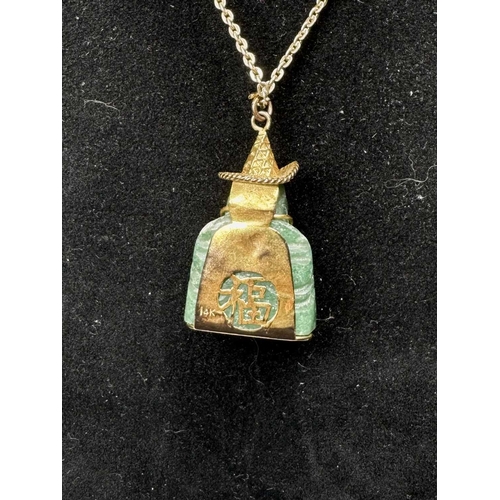 636 - A carved aventurine quartz Buddha pendant, with trace-link chain, pendant stamped 14k, length of pen... 