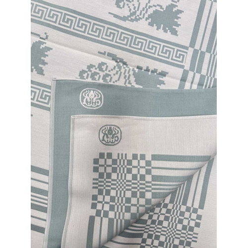 65 - A Georg Jensen linen tablecloth woven with fruiting vine motifs, teal on white ground, 150 by 200cm... 