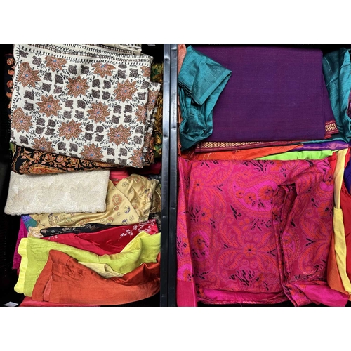 67 - A large selection of sarees and fabrics