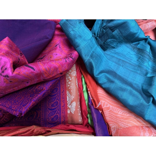 67 - A large selection of sarees and fabrics