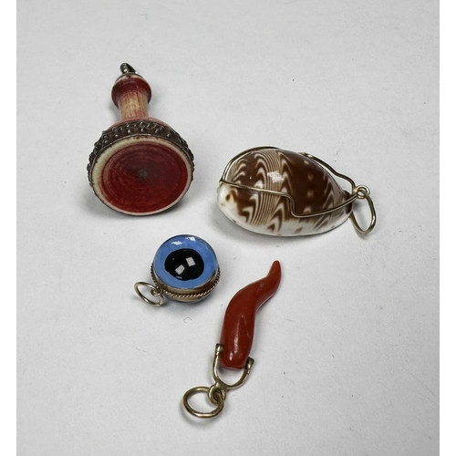 678 - A selection of four gold and silver coloured pendants, including a Victorian gold coral horn of life... 