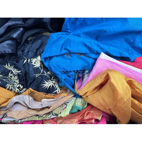 68 - A large selection of sarees and fabrics