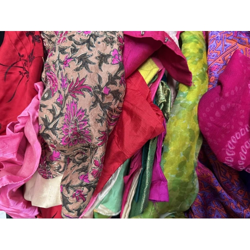 68 - A large selection of sarees and fabrics