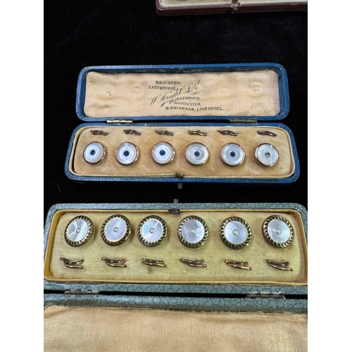 690 - Four cased sets of dress buttons/studs in their original retail boxes, yellow metal set with mother ... 