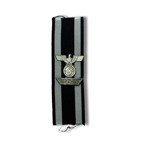 704 - German Third Reich 1939 Bar to the Iron Cross, die-cast silvered eagle and swastika resting on a tab... 