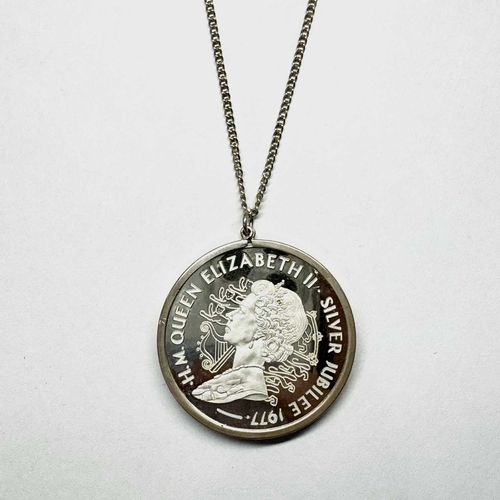 709 - Elizabeth II, a silver jubilee medal pendant, dated 1977, within a silver mount, suspended from a si... 