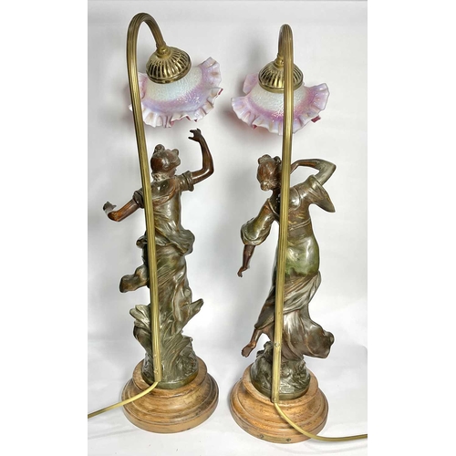 71 - Auguste Moreau (French, 1834-1917), a pair of Art Nouveau spelter figural electric lamps on wooden s... 