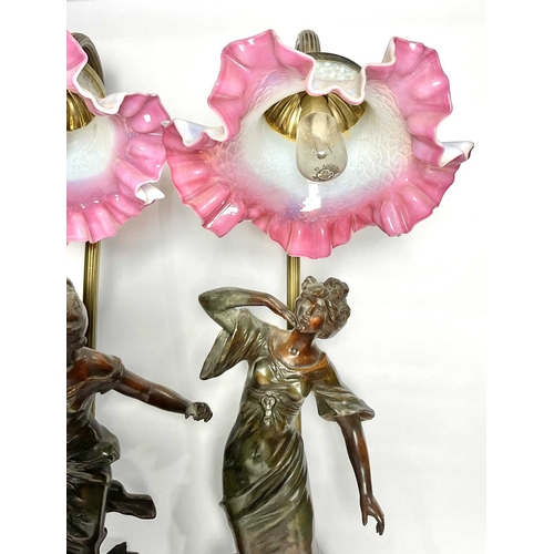 71 - Auguste Moreau (French, 1834-1917), a pair of Art Nouveau spelter figural electric lamps on wooden s... 