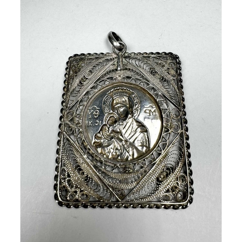 725 - A large white metal repoussé and filigree crowned Virgin and Child Icon rectangular pendant, 24g, bo... 