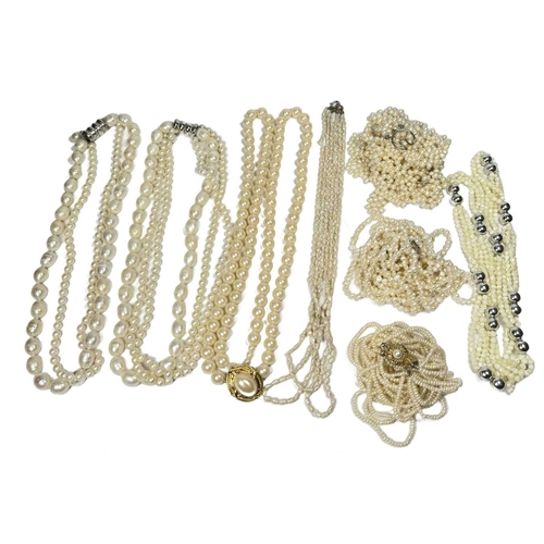 736 - A large selection of pearl jewellery, to include freshwater pearl multi-strand necklaces, cultured b... 