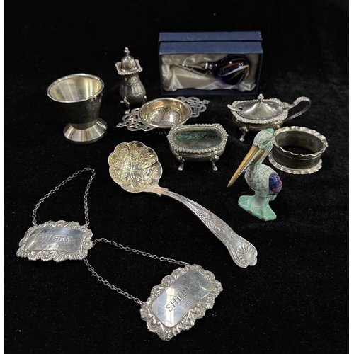 743 - A collection of hallmarked silver and plate including spirit labels, silver napkin ring, boxed scent... 